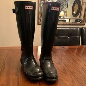 Black tall hunter boots